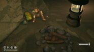 A corpse inside the Cave in TWM, next to backpack and book